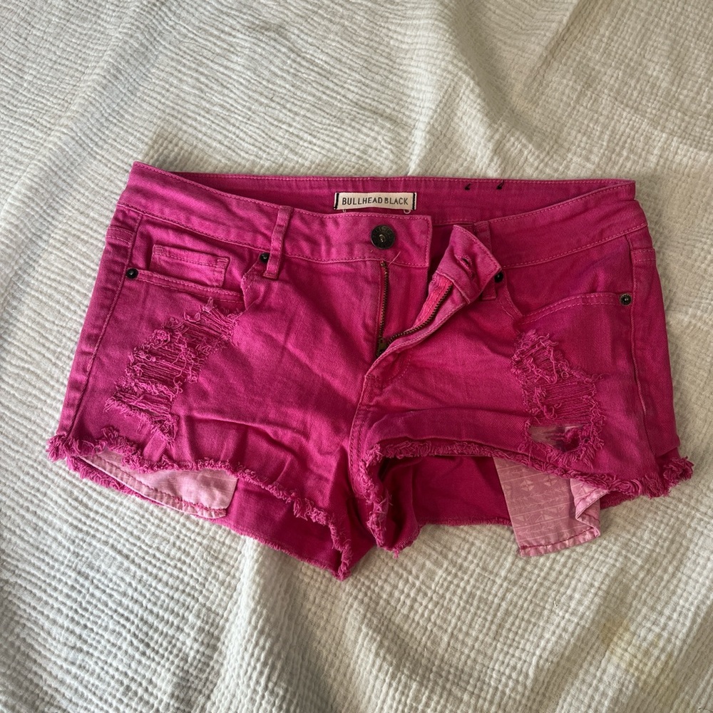 Pink distressed denim shorts
